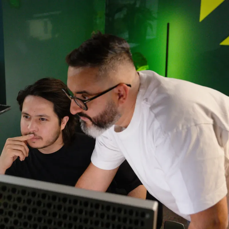 Two Setsail strategists working through a client's search data together at a monitor